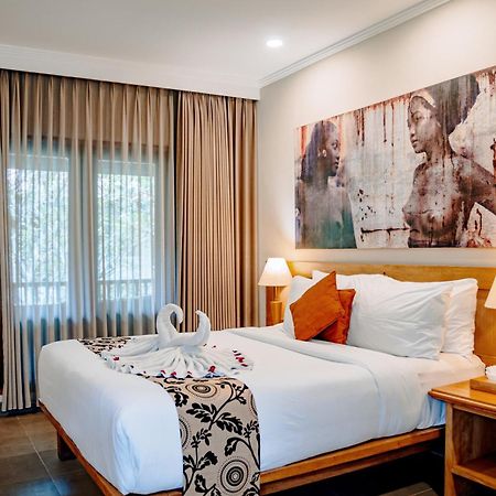 Puri Raja Hotel Legian Extérieur photo