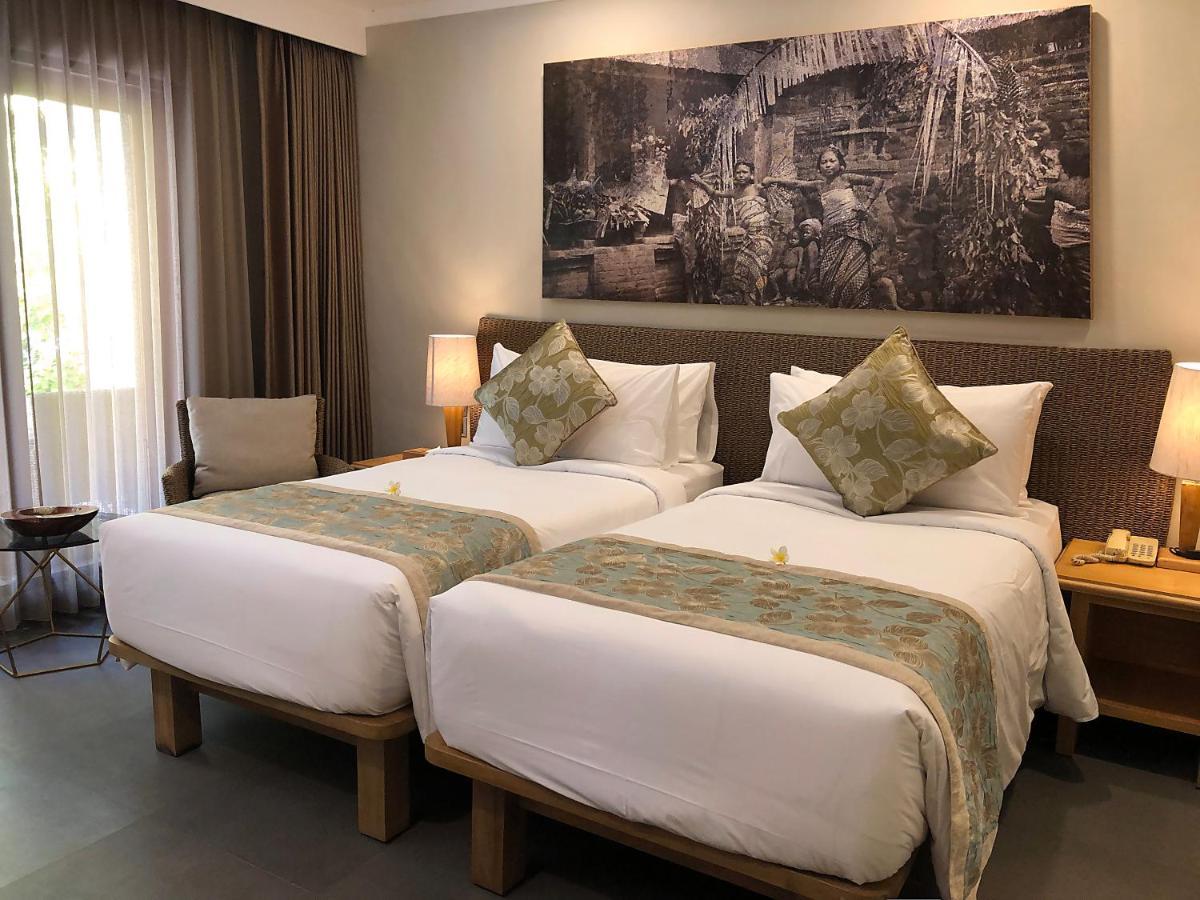 Puri Raja Hotel Legian Extérieur photo